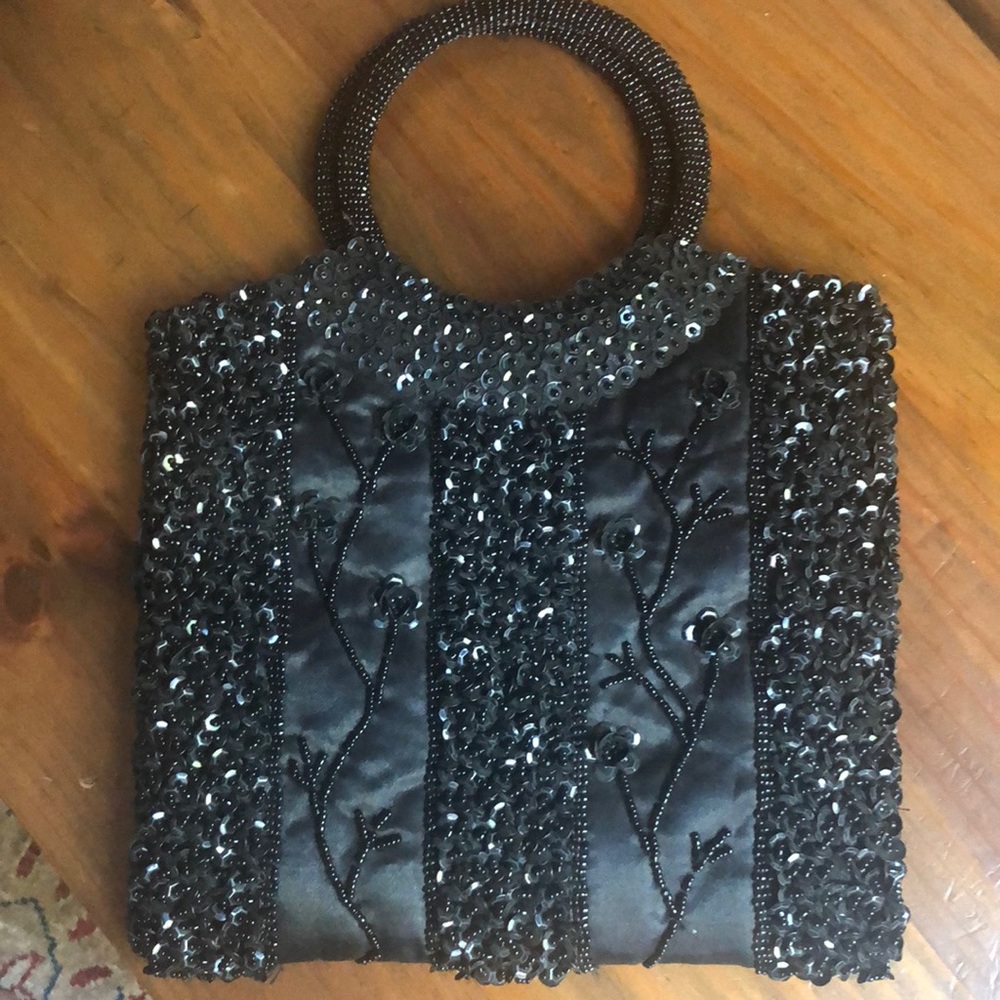 Black quilted beaded and sequined wristlet bag